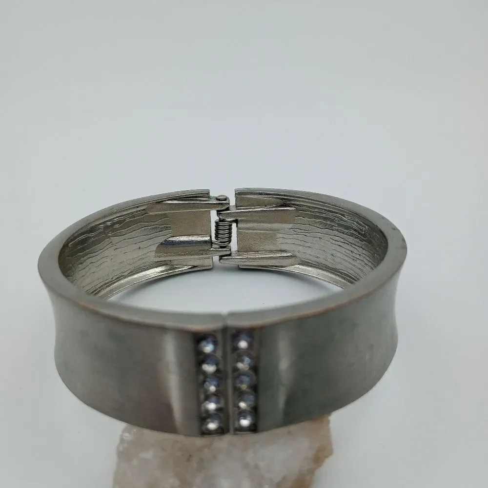 Silver tone hinge bracelet crystal encrusted accent. B533